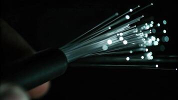 Cyber finger focus on fiber optic node illuminated light pulses with binary code macro view technology environment photo