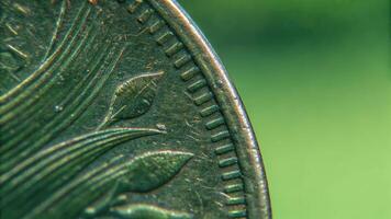 Macro view of antique coin engravings in nature highlighting historical value and texture photo