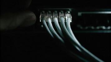 Cyber finger focus on fiber optic node high-tech environment macro image with light pulses and binary code photo
