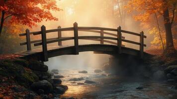 Autumnal bridge over a serene stream in a lush forest photo