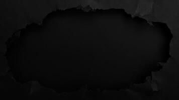 Torn black paper reveals a dark negative space for creative design and concepts photo