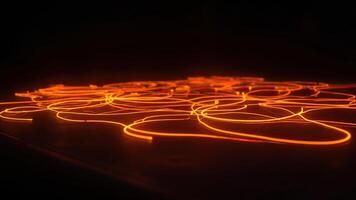 Glowing orange fiber optics illuminated against a black background create abstract lines photo