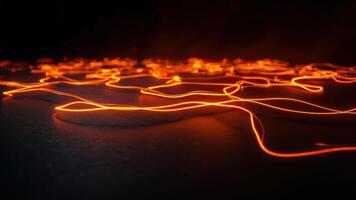 Abstract orange light trails in dark backdrop representing energy flow or modern technology photo