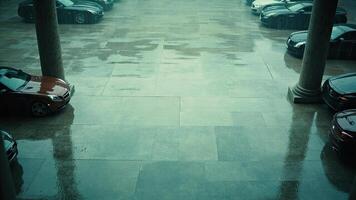 Luxury cars parked under a rainy sky in a modern architecture setting photo
