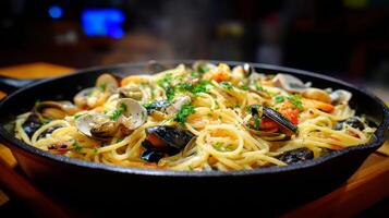 Delicious seafood spaghetti dish served in a cast iron skillet with fresh herbs and a hint of steam for a mouthwatering presentation photo