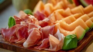 Delicious ham and juicy melon combination arranged on a rustic wooden board for a gourmet dining experience photo