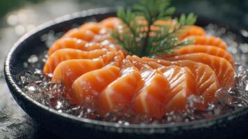 Freshly Sliced Salmon Sashimi on Ice Garnished with Green Leaf in a Stylish Black Bowl Ready for Gourmet Dining Experience photo