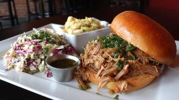 Delicious pulled pork sandwich served with coleslaw and macaroni cheese on a wooden table in a restaurant setting photo