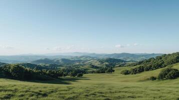 A green field with hills and trees photo