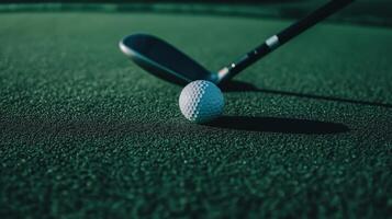 A golf club rests on a vibrant green putting surface photo