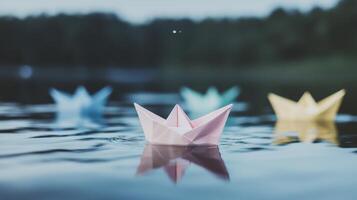 Paper boats floating in water photo