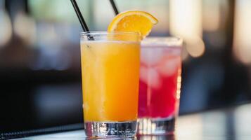 Two drinks with orange slices on a bar photo