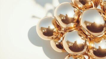 A bunch of gold balloons on a white surface photo