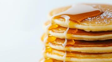 A stack of pancakes with syrup and syrup photo