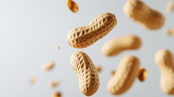 Peanuts in shells floating mid-air against a white background photo