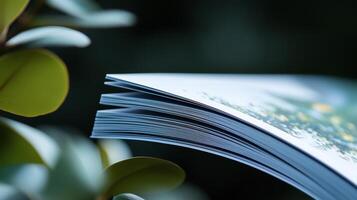A book is open on a plant photo