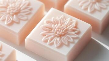 Four soap bars with flowers on them photo