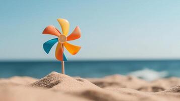 A pinwheel on the beach with a blue sky in the background photo