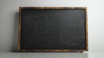 Empty black chalkboard with wooden frame on white background. Mockup with copy space for design and text photo