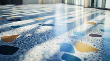 Terrazzo floor with colorful stone inlays and natural light reflections photo