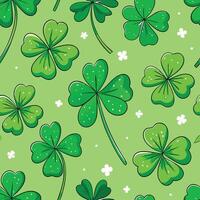 seamless pattern with clover leaves on green background vector