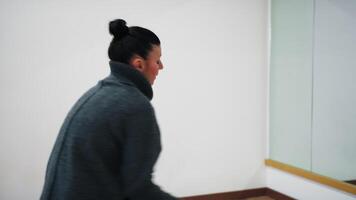 A Woman Frees Herself From Sadness By Dancing In The Hall With Movements video