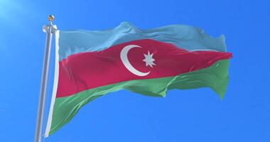 Azerbaijan flag waving at wind in slow with blue sky, loop video