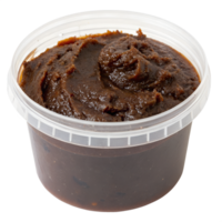 A transparent plastic container with a screw-on lid, filled with thick, dark-brown tamarind paste, isolated on the transparent background png