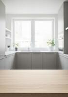 Empty kitchen table with wooden top and white counter photo