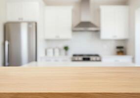 Empty wooden table in kitchen with blurred background photo