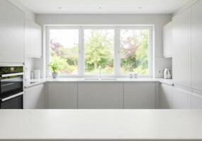 A white kitchen with a window in the middle photo