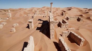 A desert with ruins and sand dunes photo
