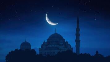 The moon and mosque in the night sky photo