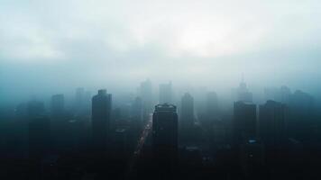 Foggy city skyline with skyscrapers in the distance photo
