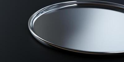 Shiny silver metal tray on dark background reflecting light photo
