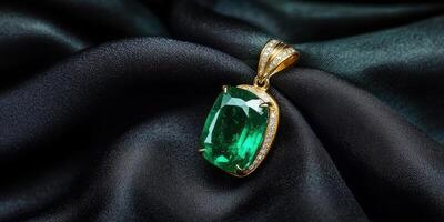 Luxurious gold pendant with emerald gemstone on elegant black silk background photo