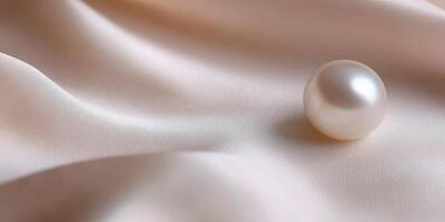 Elegant pearl on smooth beige satin fabric surface reflecting luxury concept photo