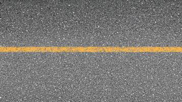 Single yellow line on asphalt road surface for transportation and urban design concepts photo