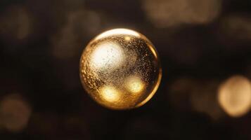 Glowing golden sphere with textured surface floating in dark atmosphere photo