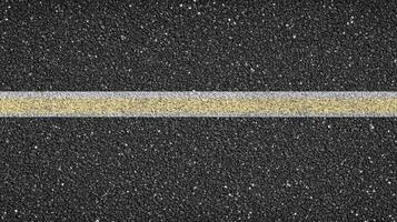 Close-up of asphalt road with yellow and white lines abstract texture concept photo