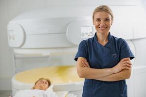 Portrait of doctor radiologist on background of MRI or CT Scan with patient undergoing procedure photo