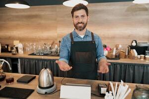 Barista joyfully greets a loyal customer while standing behind counter photo