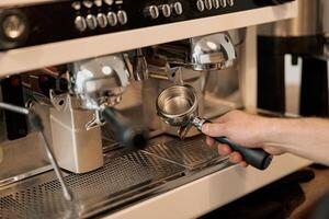 Photo of the process of installing portafilter in coffee machine