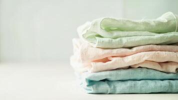 A stack of colorful cloths on a table photo