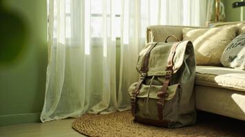A bag sitting on a rug in front of a window photo