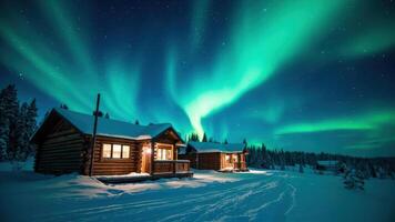 Northern lights over a cabin in the snow photo