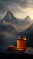 Golden jar of honey with honeycomb against majestic mountain backdrop photo