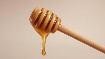 Honey dipper with dripping golden honey on a beige background, representing sweetness photo