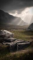 Mountains and plaid bedding under dramatic cloudy sky with sun rays, nature scene photo