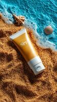 Sunscreen cream tube on sandy beach with seashells and ocean waves, summer skincare concept photo